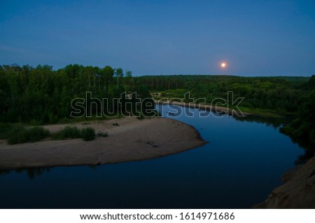 Lunar astronomical landscape over the lake