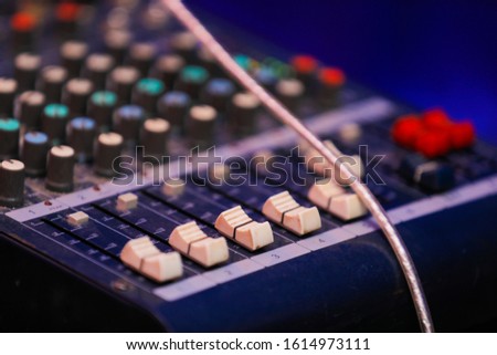 Music mixer control panel. Closeup