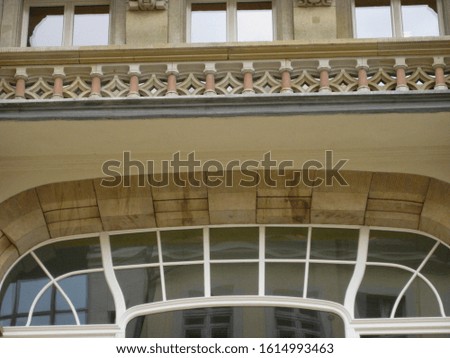 artistic balcony on the house with windows