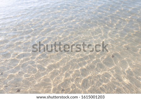 Texture pattern of blue ocean water and bright ripple water and surface transparent and sunlight In the morning. Background sea top view