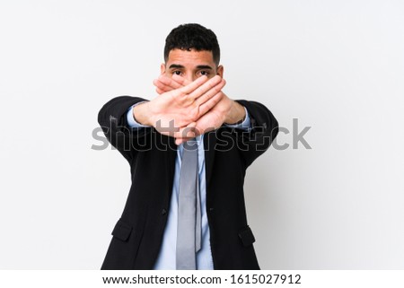 Young latin business woman against a white background isolated doing a denial gesture