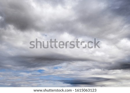 Fluffy clouds in the overcast sky view. Climate, environment and weather concept sky background.