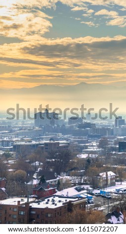 Vertical frame Sunset view of Salt Lake City, Utah in winter