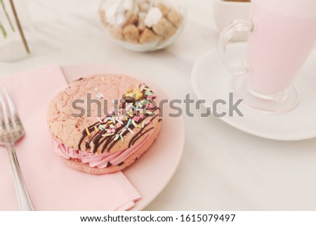 Cute pink cookie in sweet coffee cafe