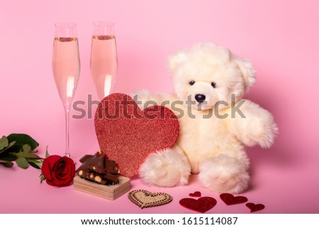Valentine's day card with champagne and hearts.