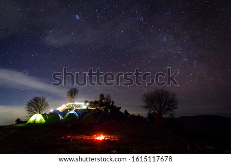 Dehradun Night Photography in Uttarakhand India. Camping under night sky with full of stars on new year eve. Light painting in the snow mountains of Uttarakhand India. Night photography. - Image  