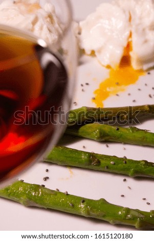 Wine, sparragus and pouched eggs, high cuisine