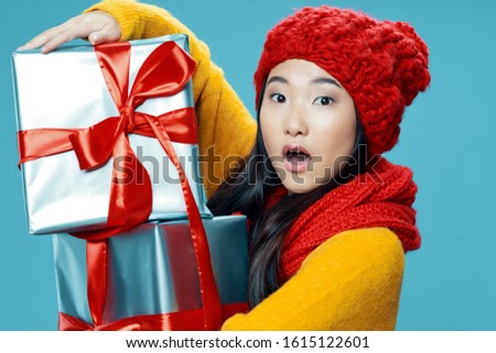 gift boxes and pretty woman warm clothes