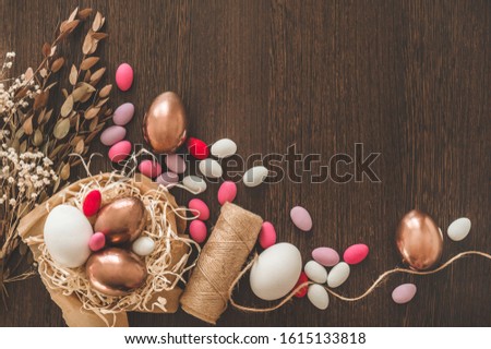Happy Easter. Flat Lay of Golden Easter Eggs on wooden background. Easter background. Easter concept