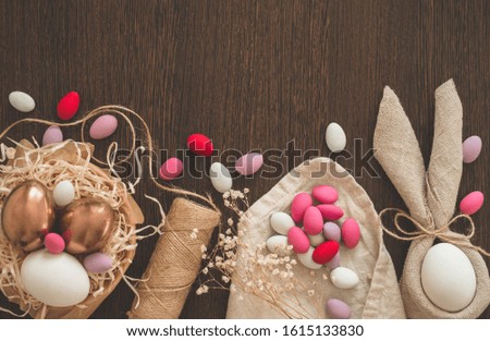 Happy Easter. Flat Lay of Golden Easter Eggs on wooden background. Easter background. Easter concept