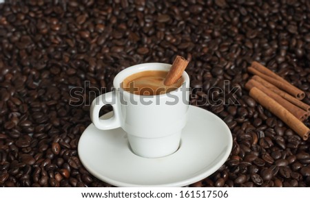 cup of coffee with coffee beans.