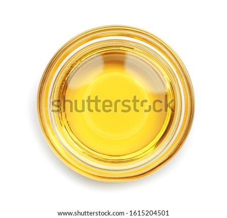 Cooking oil in glass bowl isolated on white, top view Royalty-Free Stock Photo #1615204501
