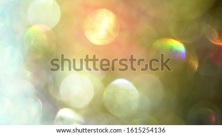 Blurred abstract photo of light burst and glitter golden bokeh lights. As Background.