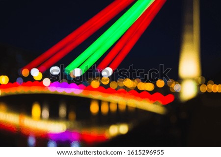 Abstract defocused background of colorful city lights at night. Blurry backdrop