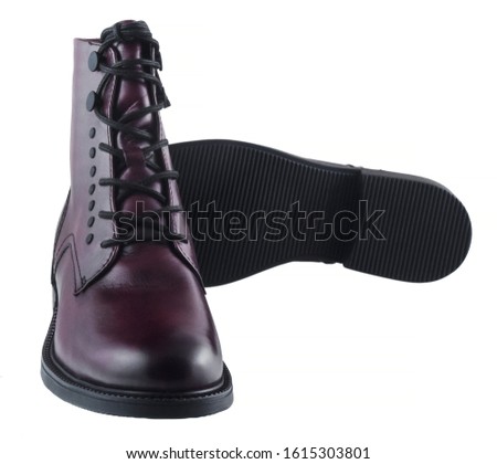 Burgundy female leather warm boots isolated on white background