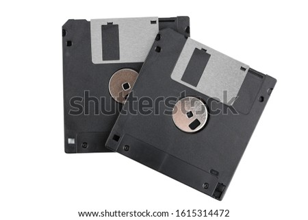 Old computer diskette over white background. Black Diskette. 