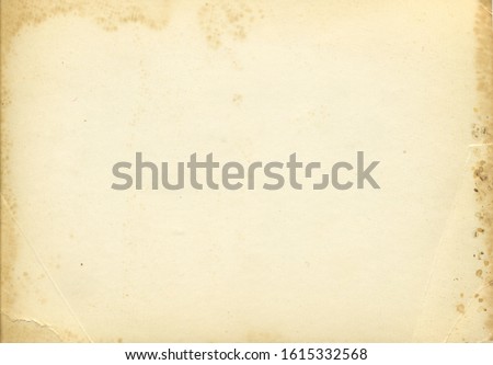Retro photo paper texture. Old antique paper texture. Vintage paper background. Aged and yellowed postcard. Royalty-Free Stock Photo #1615332568