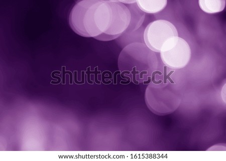 Dark purple background bokeh blurred abstract background.