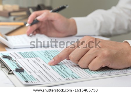 businessman working with documents in office Royalty-Free Stock Photo #1615405738