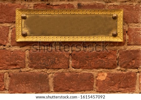 blank plate on brick wall