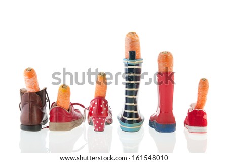 Row shoes with carrots for Dutch holidays isolated over white background