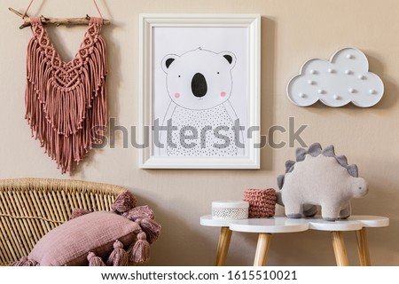 Stylish scandinavian nursery interior with mock up photo frame, plush dino, design furniture, pillows and accessories. Beautiful decoration on the beige background wall. Home decor for children room.