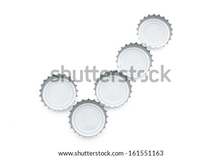 Conceptual check mark image made of used beer caps over white background