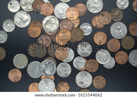 A table full of loose american coins Royalty-Free Stock Photo #1615544062