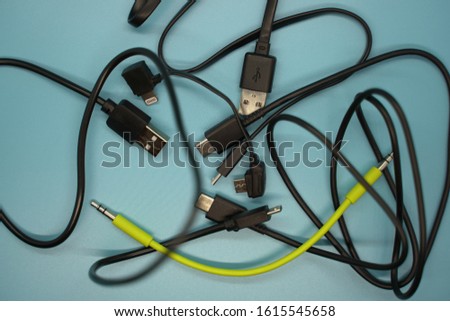 A bundle of charging cords Royalty-Free Stock Photo #1615545658