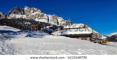 Small chalet on the mountains with snow