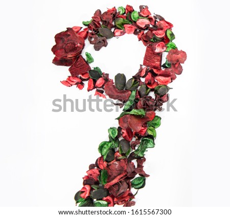 Latin alphabet number made from dry rose flowers.