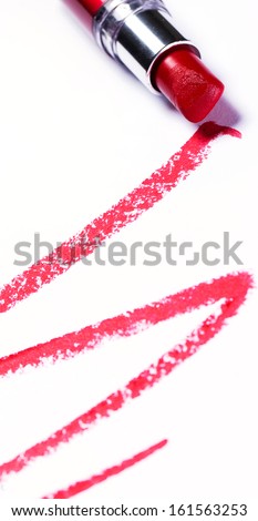 Red lipstick with trace over white background