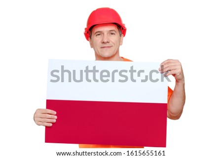 Portrait smiling middle-aged handsome worker wearing red hard hat, holding paper with polish flag in hands. Invitation to work in Poland concept, copy space for text, isolated on white