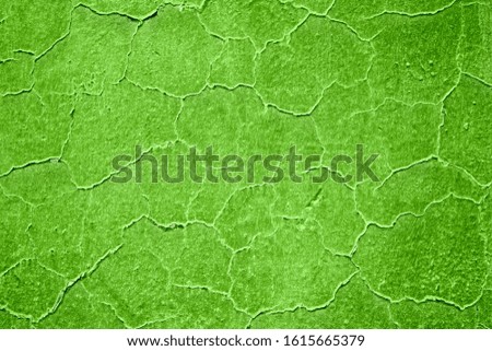 Neon grass green empty background element with cracked and perched irregular texture.