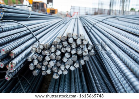 Construction steel rods or bars work reinforcement in conncrete structure of building.Background texture of steel rods used in construction to reinforce concrete Royalty-Free Stock Photo #1615665748