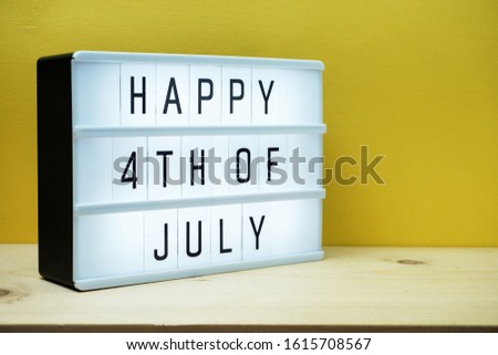 Happy 4th of July lightbox with space copy on yellow background