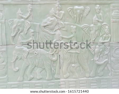 Decorative wall tiles A picture of a person sitting on the back of an elephant Green network, shadow, emboss, clear, beautiful, eye-catching