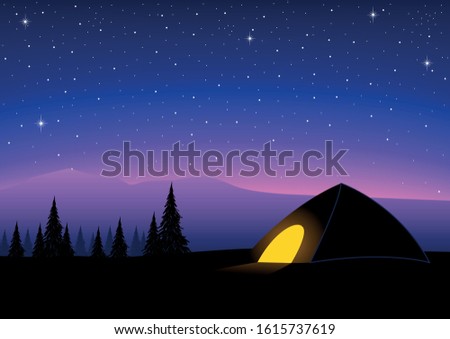 Silhouette of a tent on top of a mountain