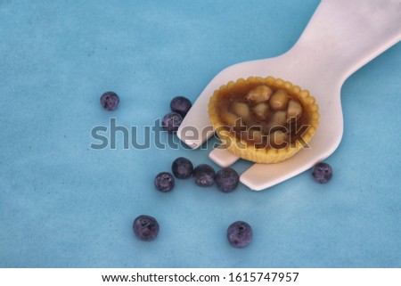 Sweet almond tart pastry photography blue background 