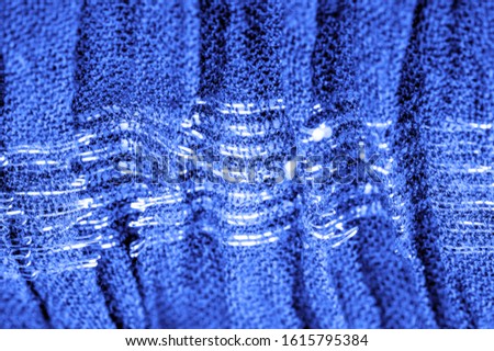 The texture of the background picture, the ornament of the decor, sapphire blue corrugated fabric, fabric with parallel or diagonal folds with serrated folds; products from such a fabric.