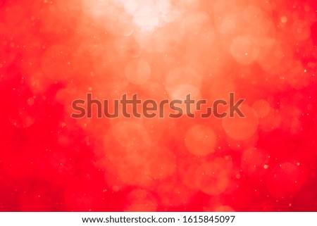 Abstract red background with blurred light bokeh