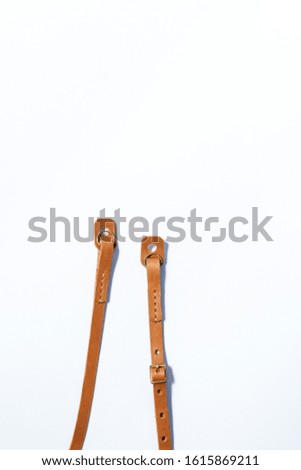 Leather camera strap with thread handmade work on white studio background