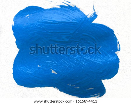 Textured brush stroke of acrylic blue paint isolated on white background. Classic blue color of the year 2020.