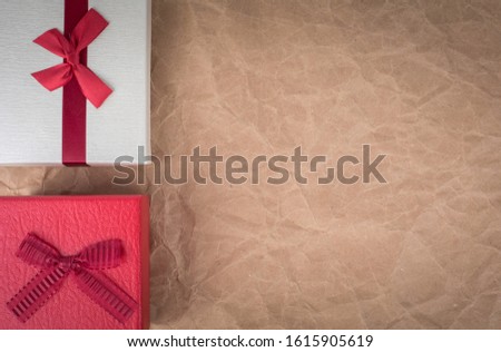 Place the gift box on old paper and copy space.