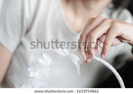 White flower crown for decorate on a woman's head . selective focus