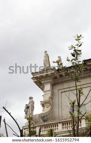 Statues on the rooftop of Santa Maria Nova (Santa Francesca Romana) situated next to the Roman Forum in Rome, Italy