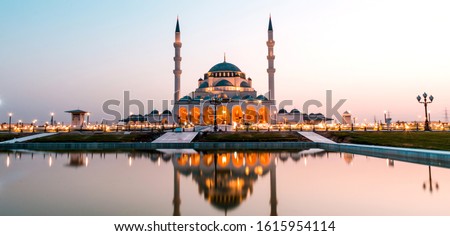 Sharjah New Mosque Famous Tourist attraction In Dubai, Arabic Letter means: Indeed, prayer has been decreed upon the believers a decree of specified times, Ramadan and Eid Concept Background Royalty-Free Stock Photo #1615954114