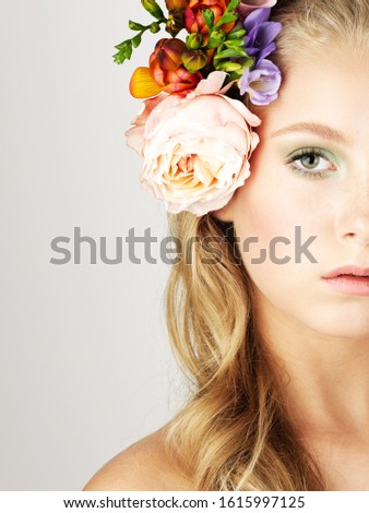 Bridal half a face portrait with flowers in hair