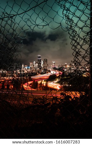 Night time cityscape long exposure of Seattle through the fence