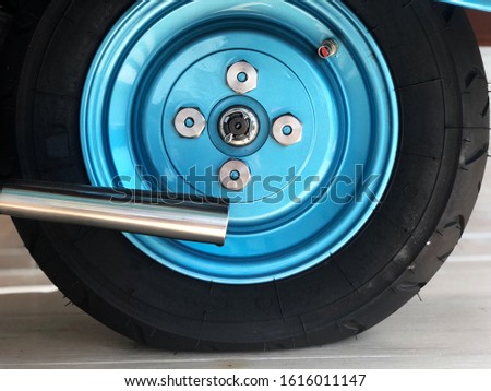 vintage Metallic blue wheels, Scooter wheels with natural light